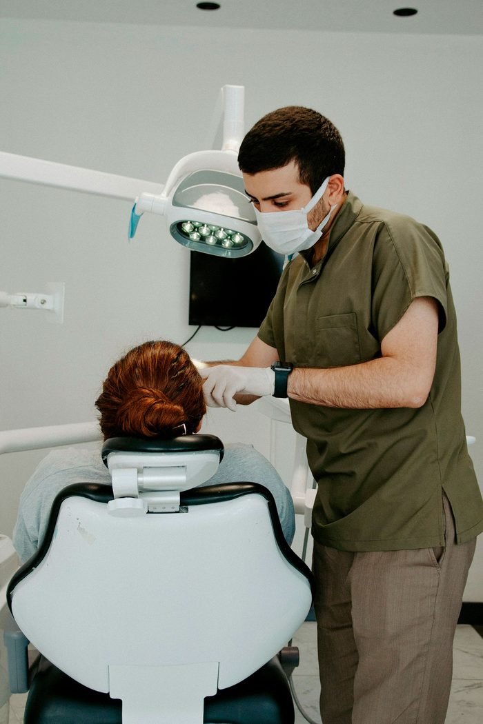 A dentist treating a patient in a modern clinic