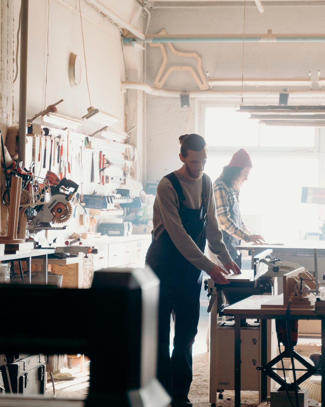 Get a business line of credit: two woodworkers at the bench in their shop